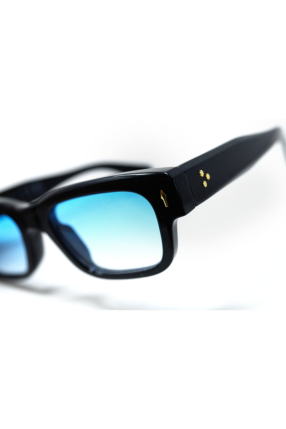 Black sunglasses with oval frame with gold detail and blue glass