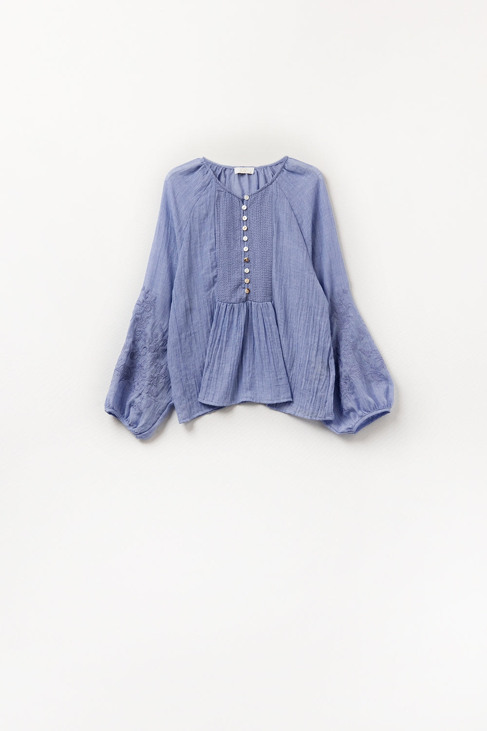 Blue chiffon blouse with embroidery on the sleeves