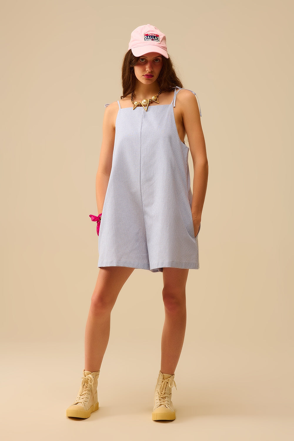 blue striped playsuit with shoulder ties and back pocket detail