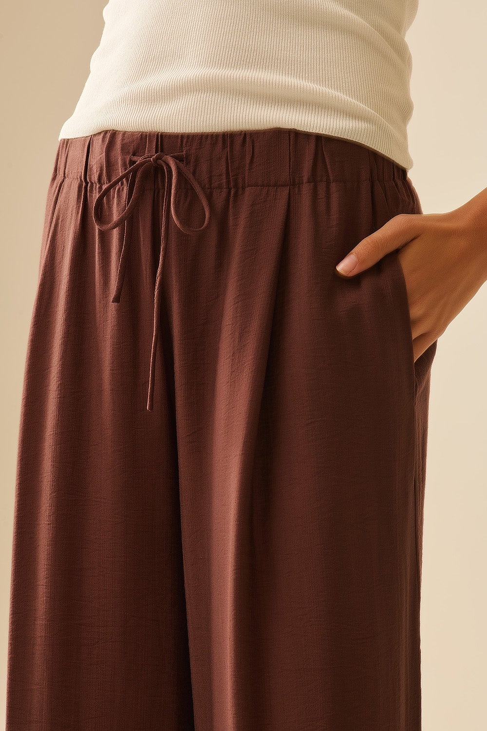 Brown pants with wide leg in light viscose fabric
