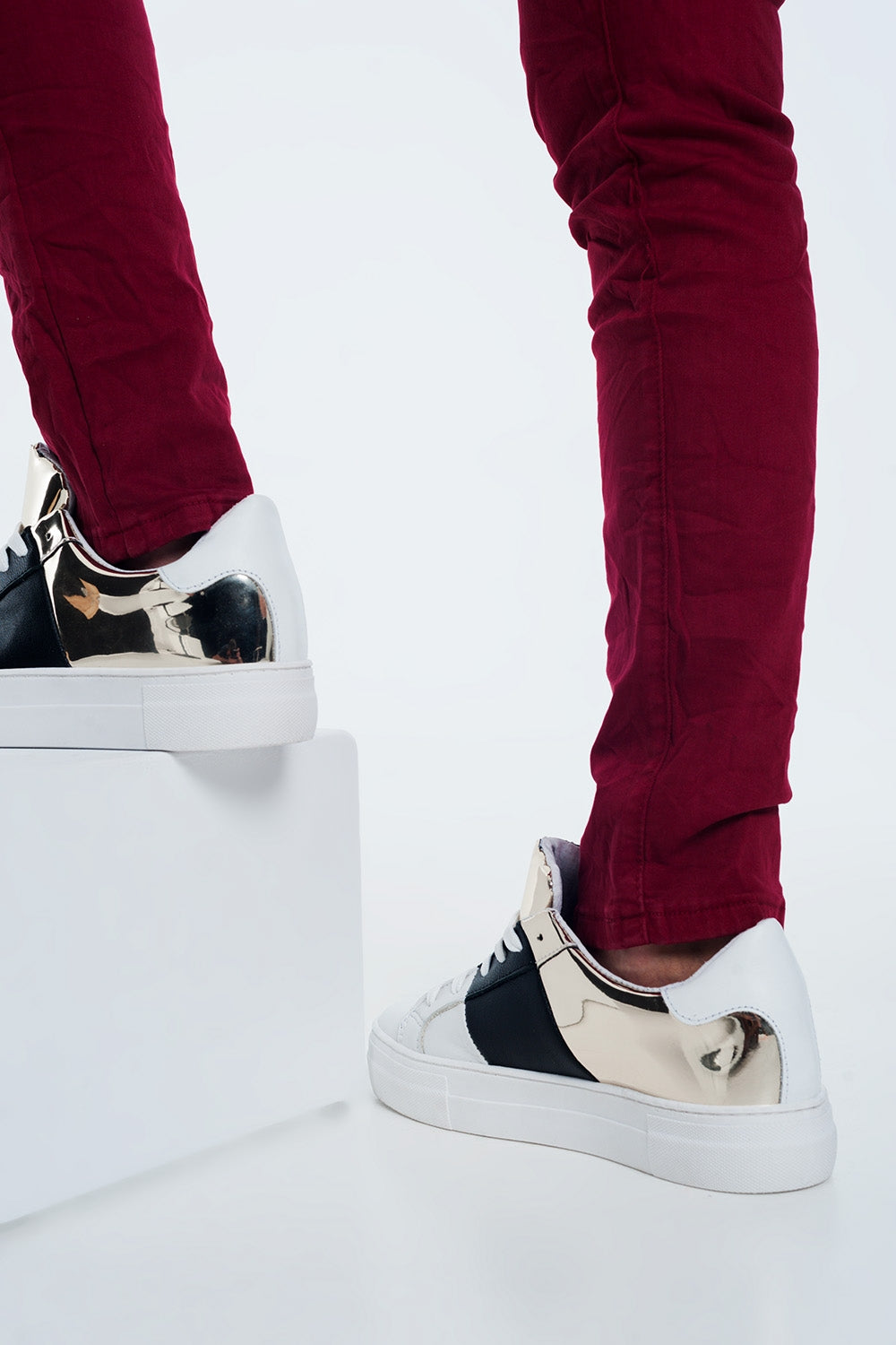 Chunky sneakers in black and gold