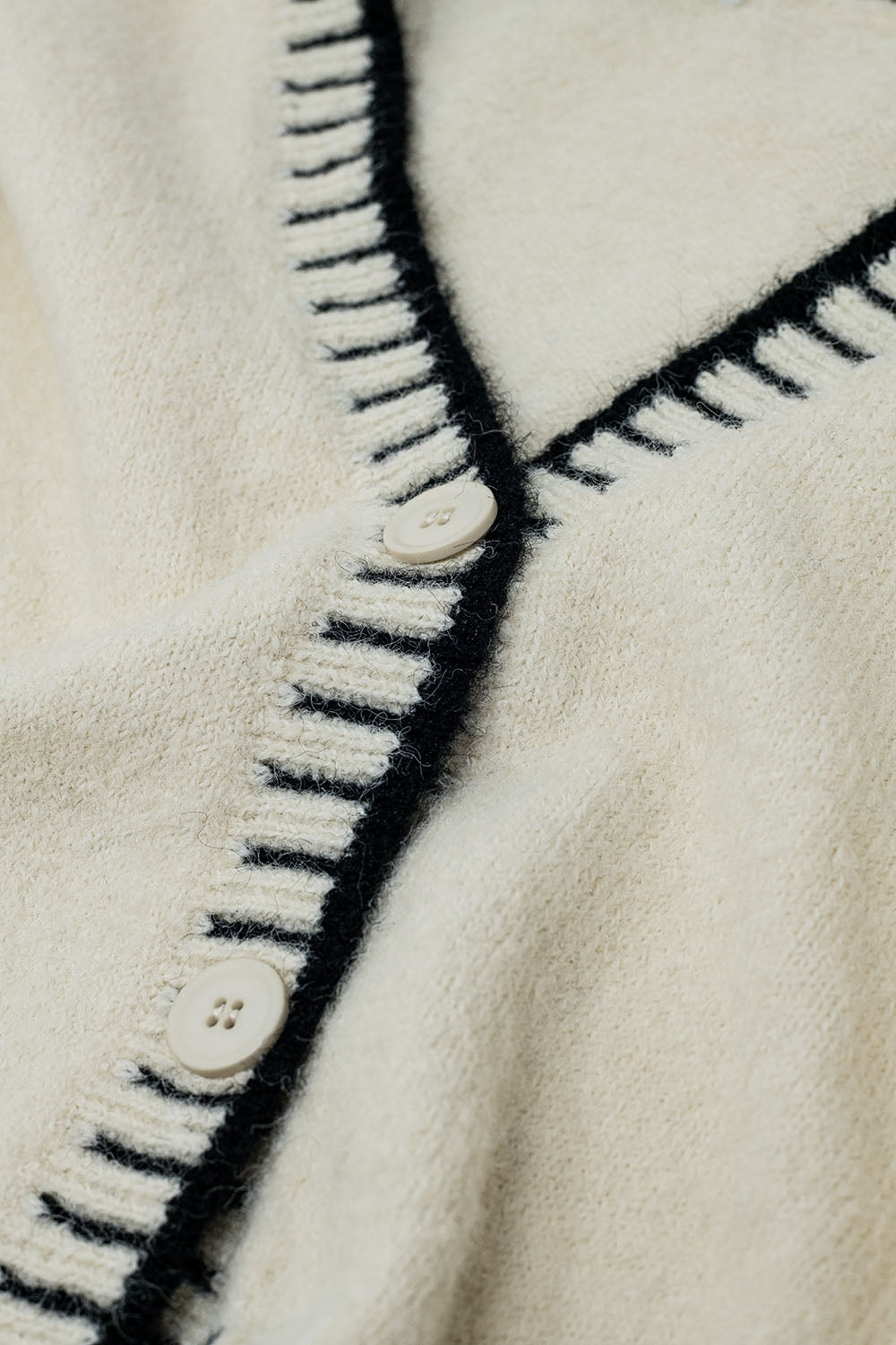 Cream cardigan with black trim