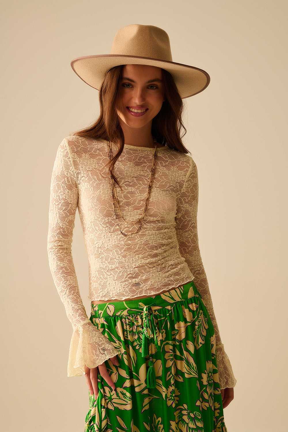 Q2 Cream lace top with long flared sleeves and ruffles