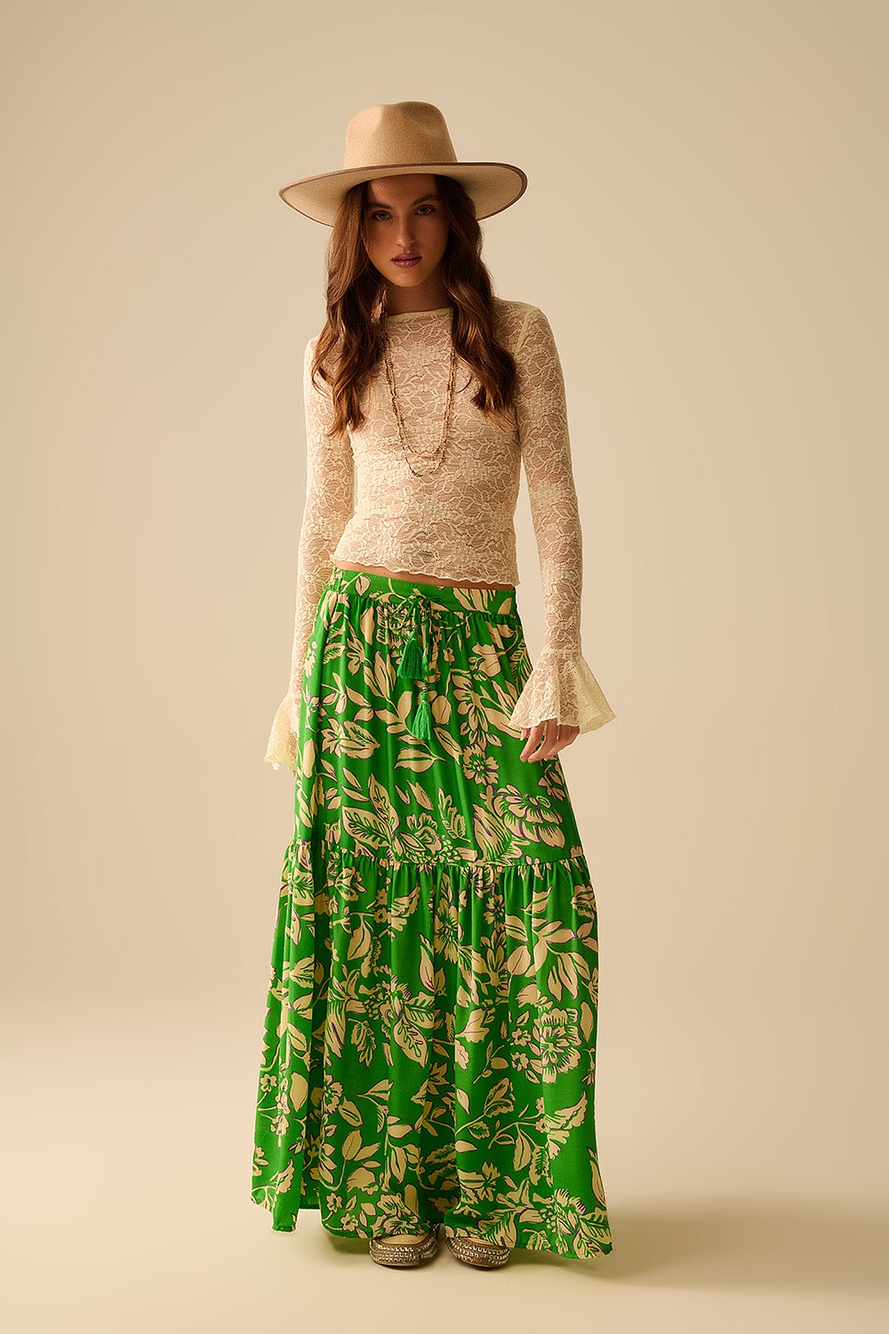 Cream lace top with long flared sleeves and ruffles