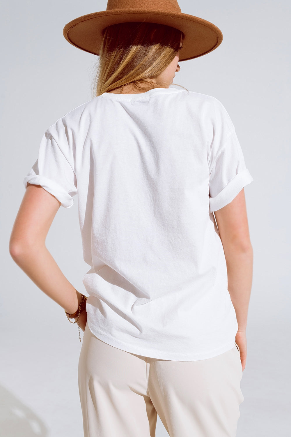 Creme T-shirt With famous Names Logos At The Front