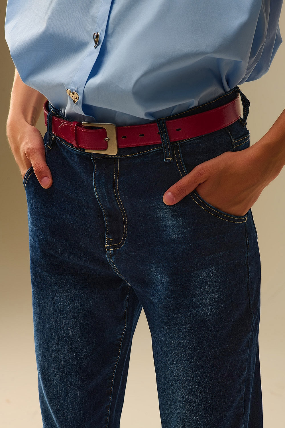 Dark wash jeans with contrast stitching and cuffed hems