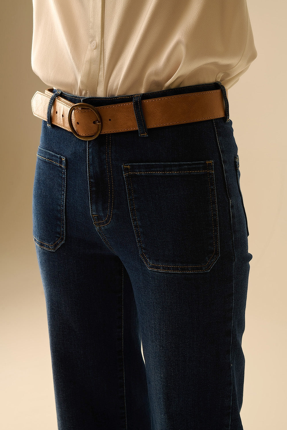Dark wash jeans with wide leg and pockets