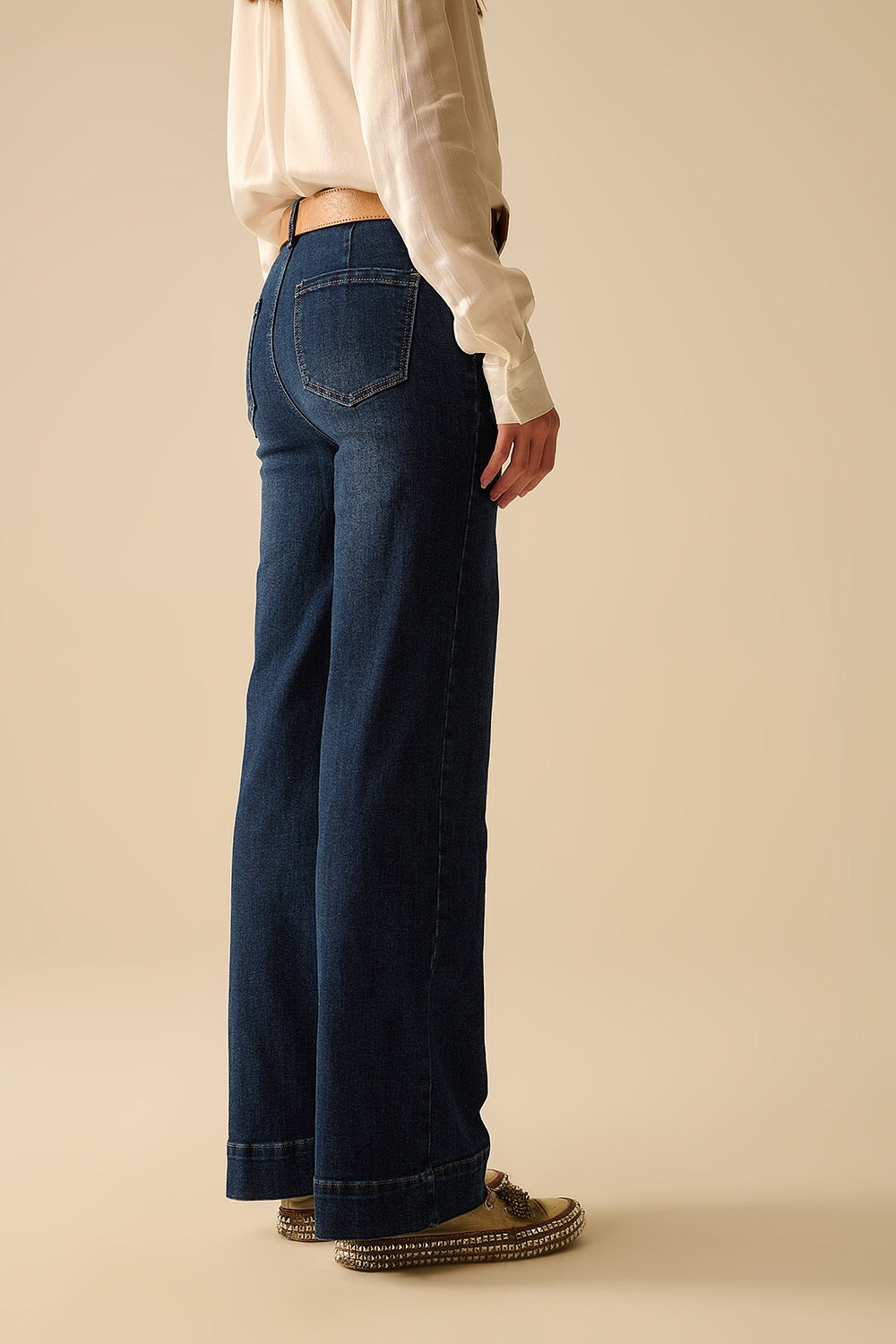 Dark wash jeans with wide leg and pockets