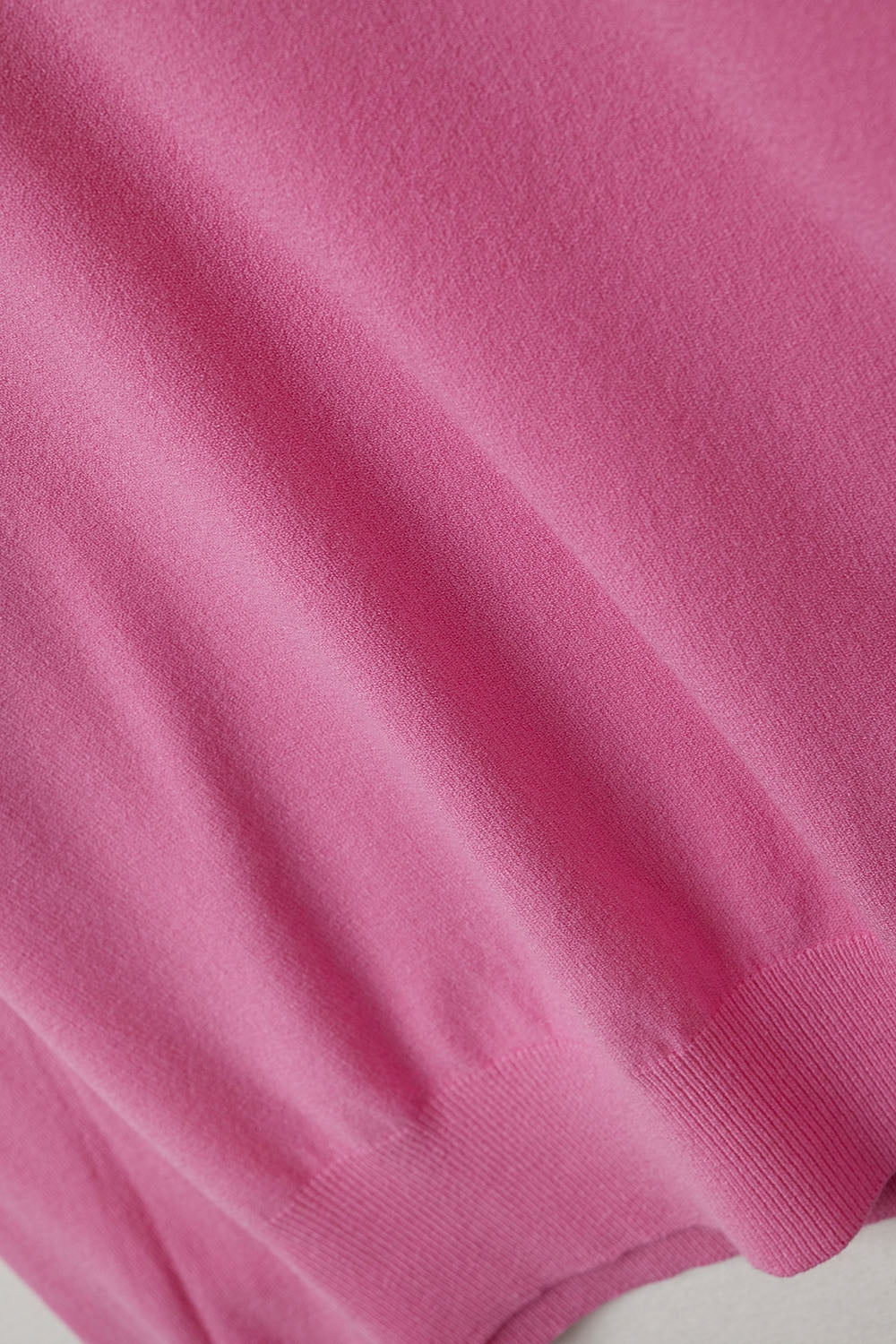 Fuschia sweater with V neckline
