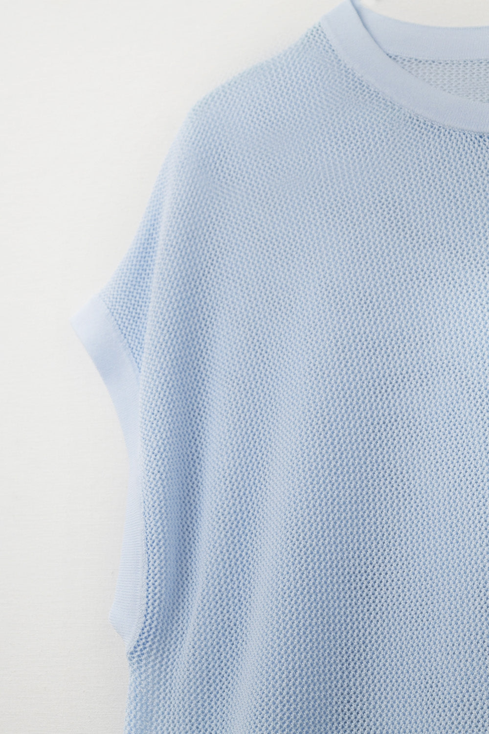 grid knit sweater in baby blue color