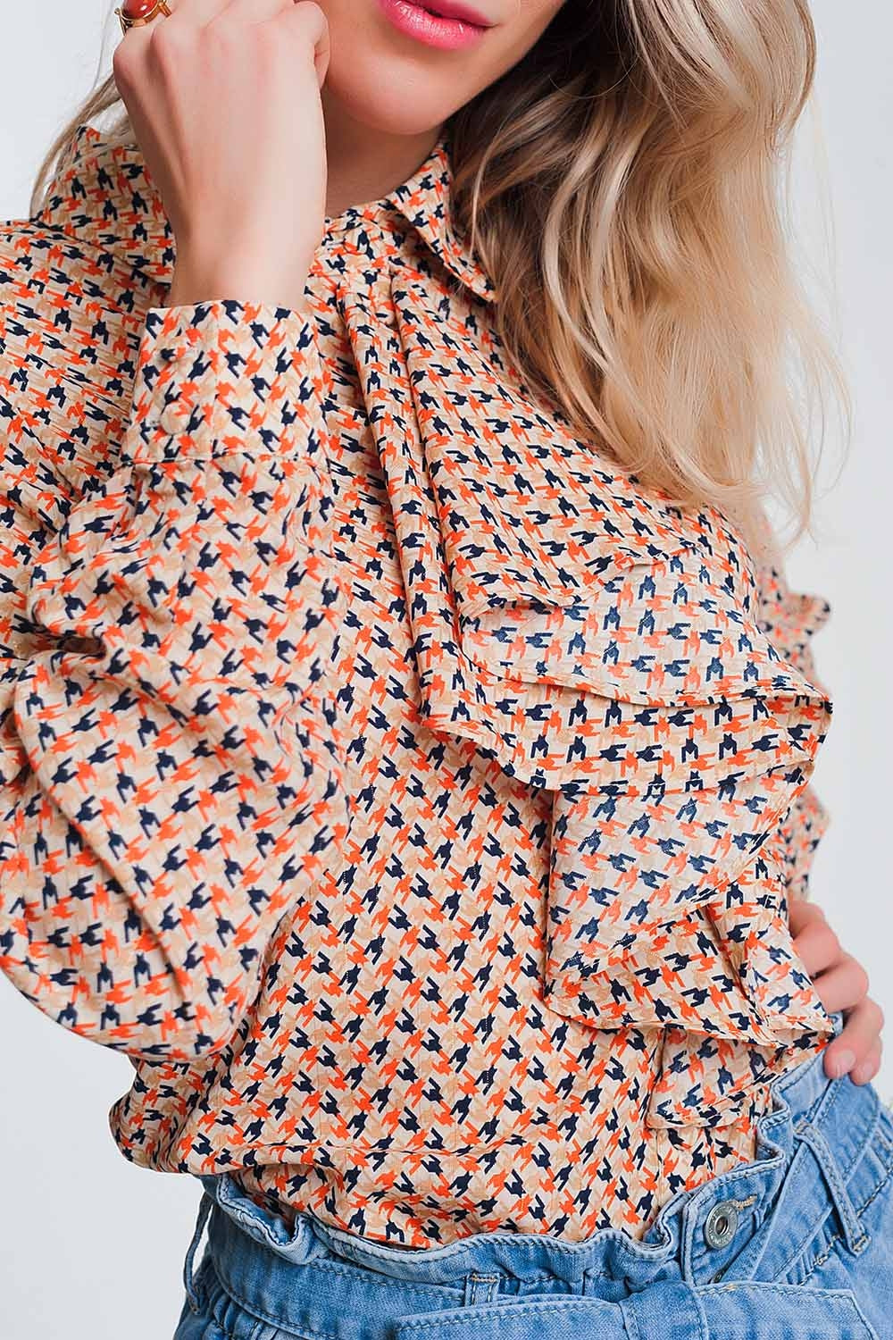 Long sleeve blouse with ruffle detail in beige