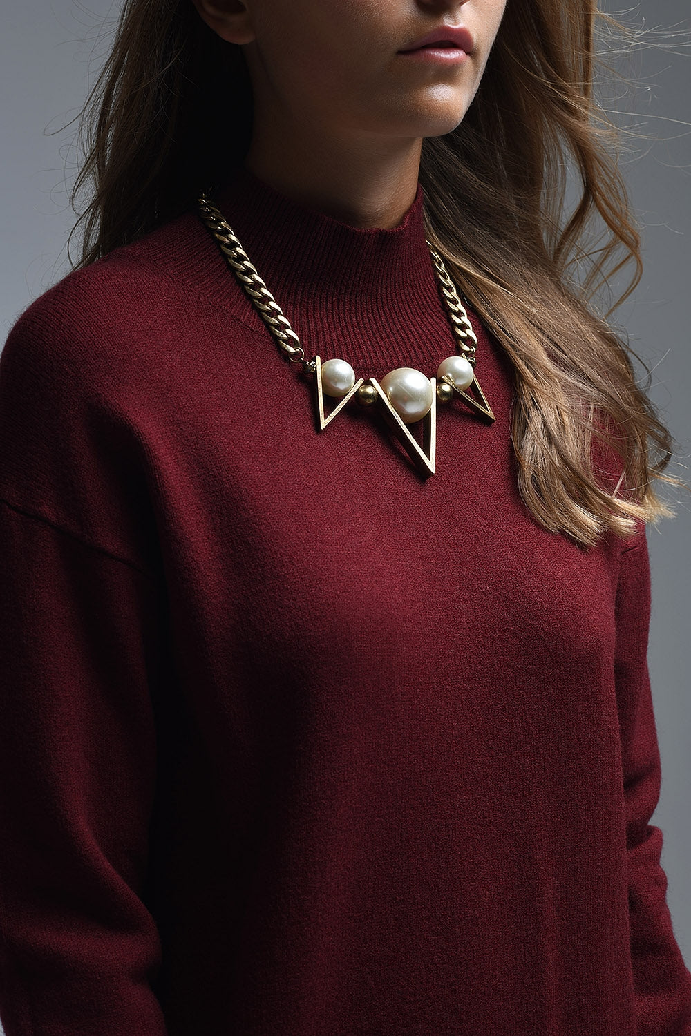 Loose burgundy sweater with open back detail