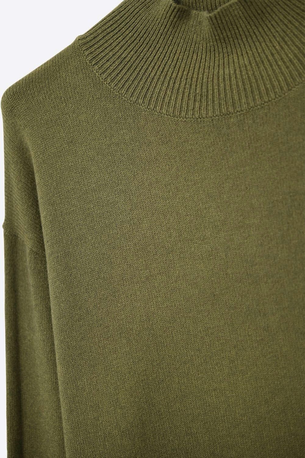 Loose military green sweater with open back detail