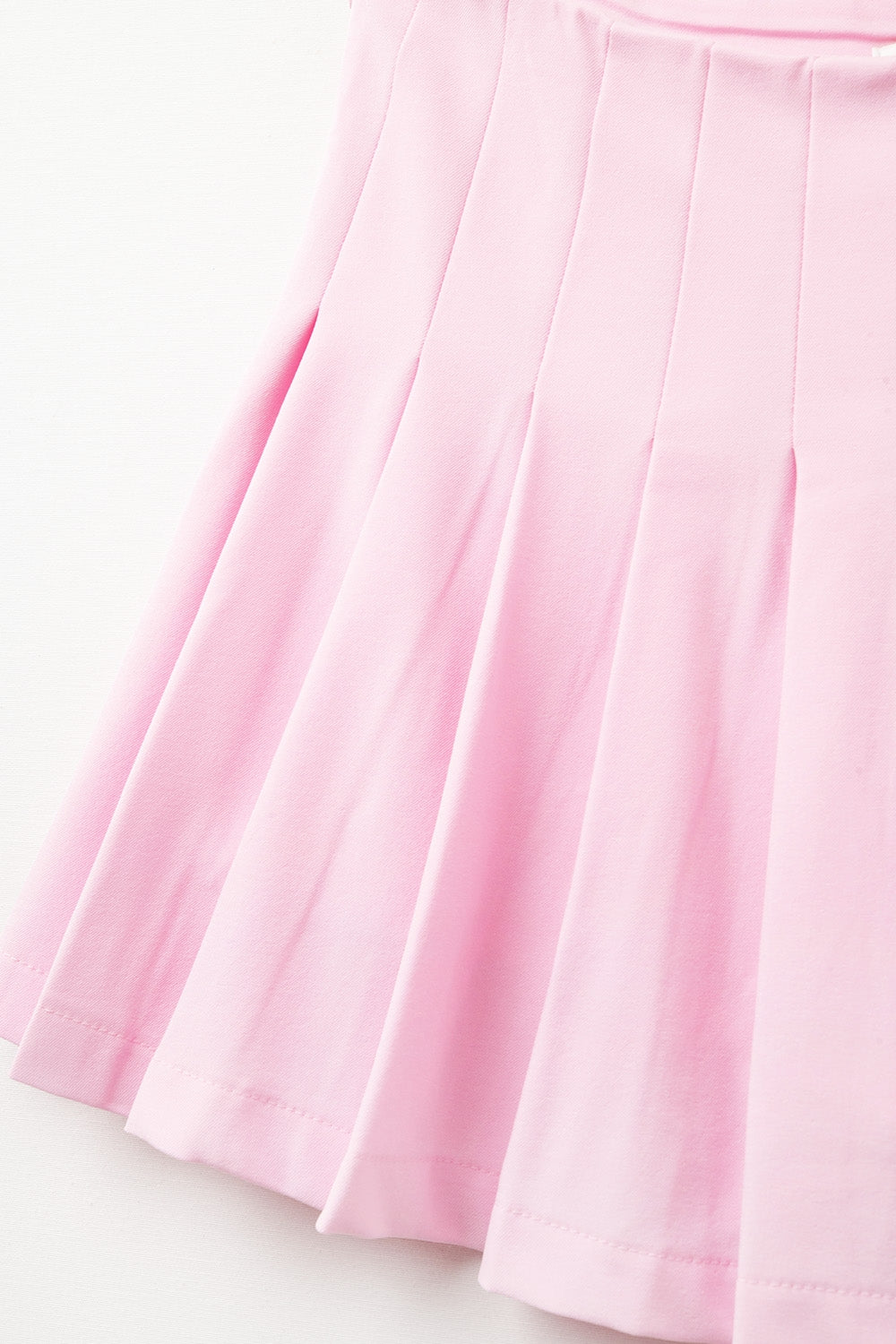 pink pleated mini skirt