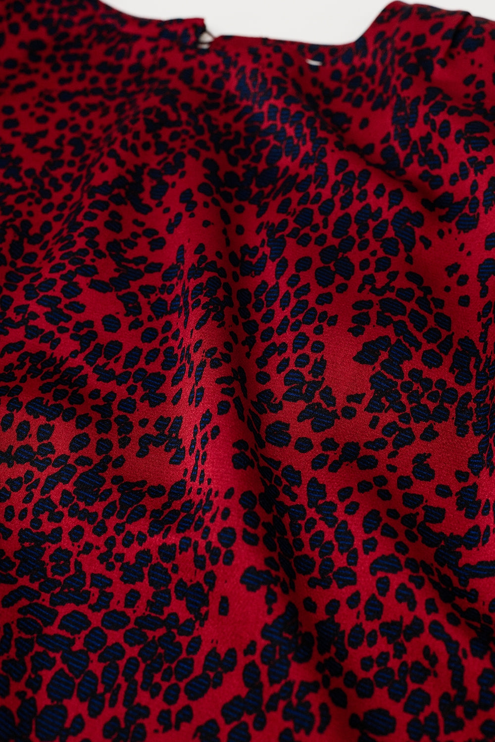 red satin sleeveless top with animal print