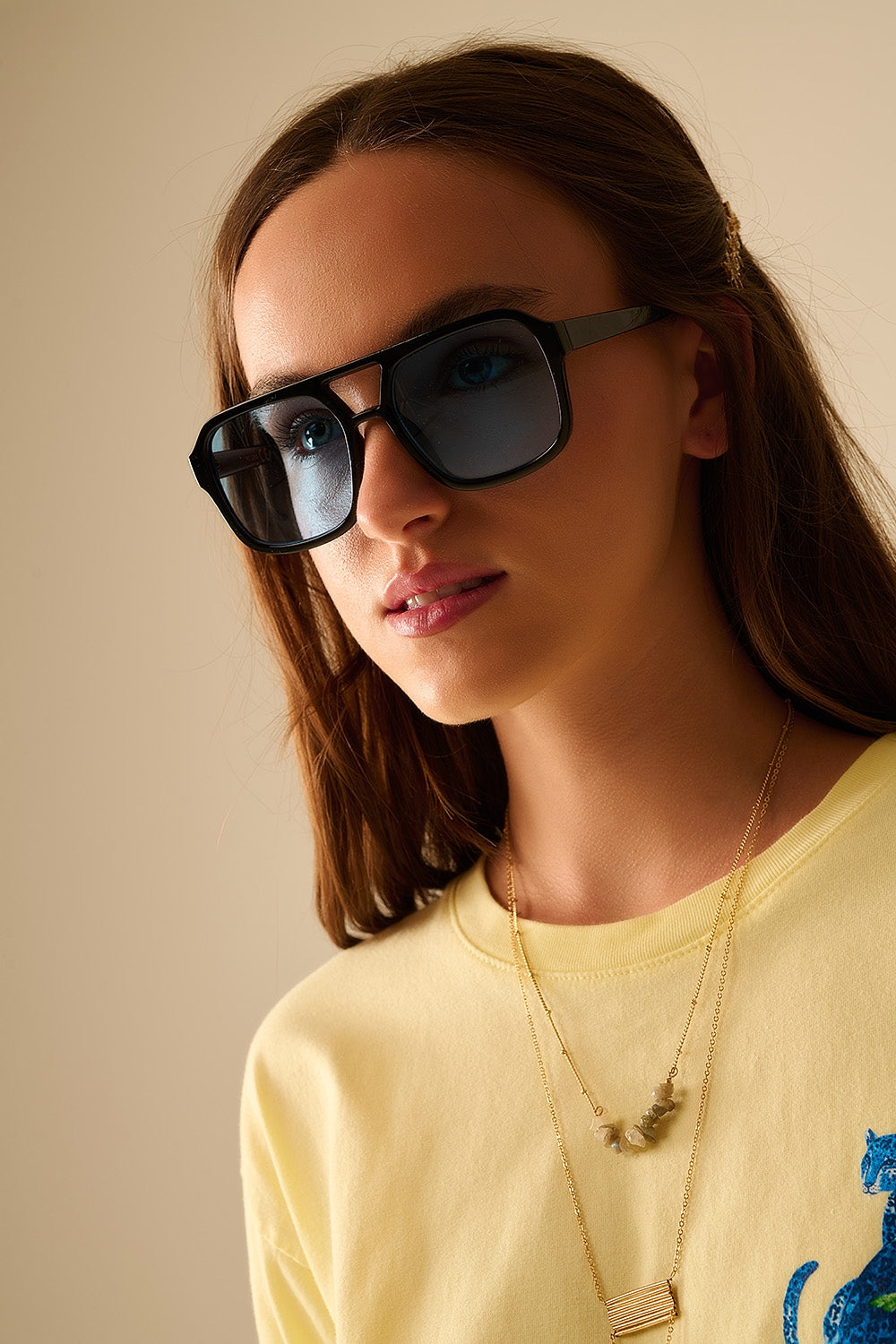 Sunglasses with black frames and blue lenses