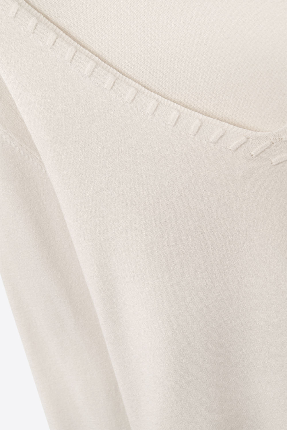 White sweater with V neckline