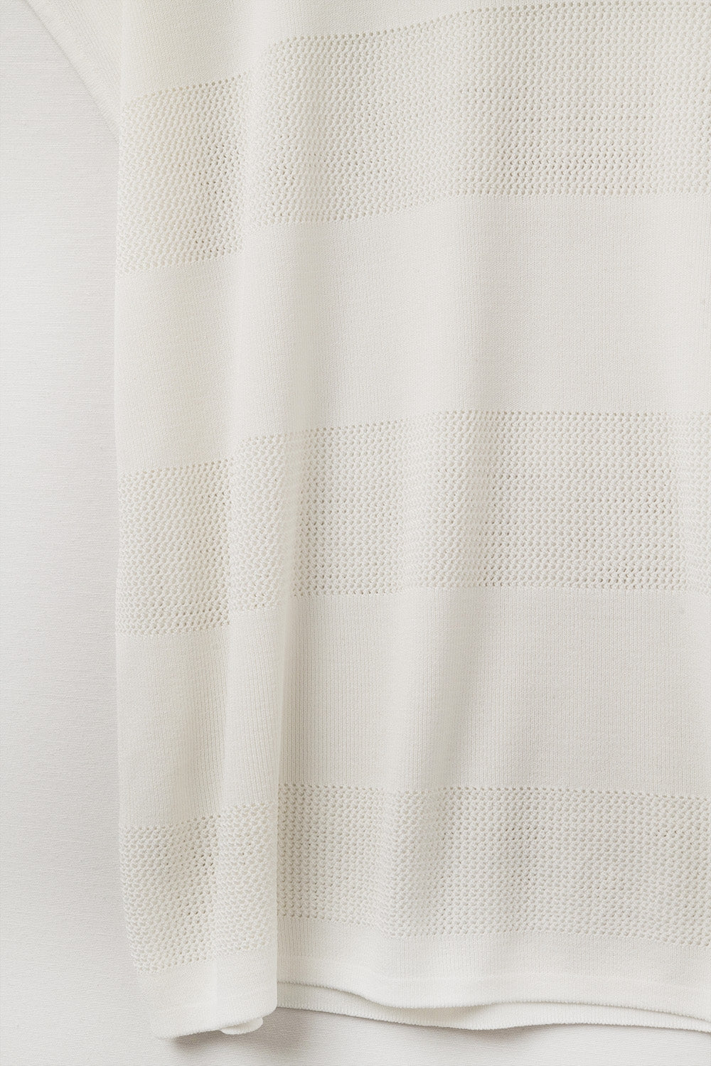 White V-neck knit sweater with open stitch detail