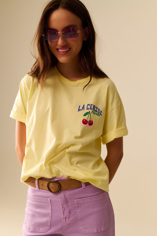 Q2 Yellow T-shirt with La Cerise Market Saint-Tropez graphic