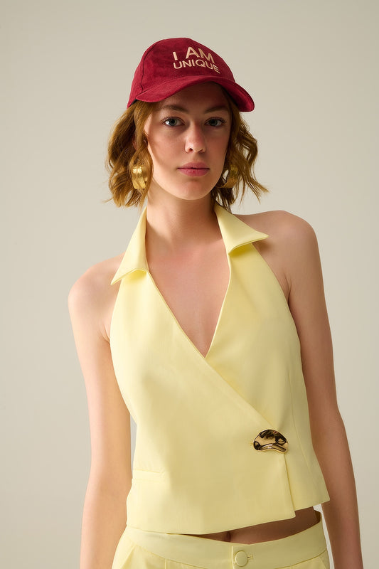 Q2 Yellow wrap vest with detailed gold button