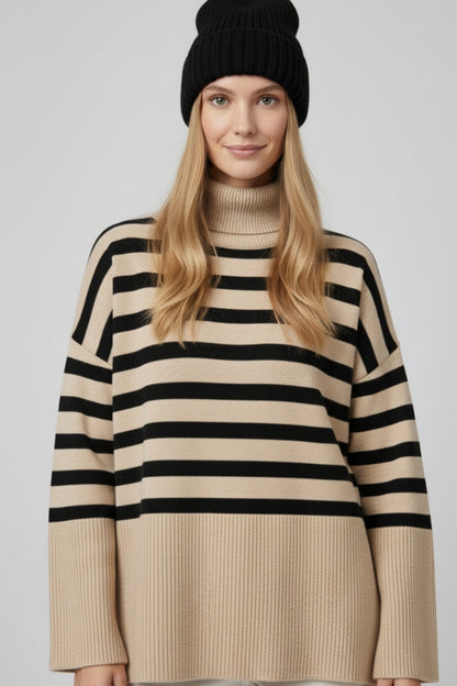 Beige oversized turtleneck sweater with black stripes and splits on the side