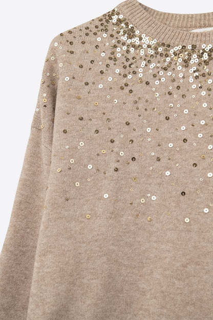 Beige soft knit sweater embellished with sequins on the front