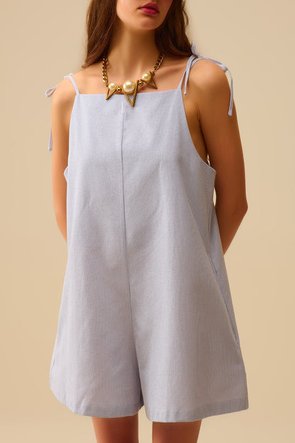 blue striped playsuit with shoulder ties and back pocket detail