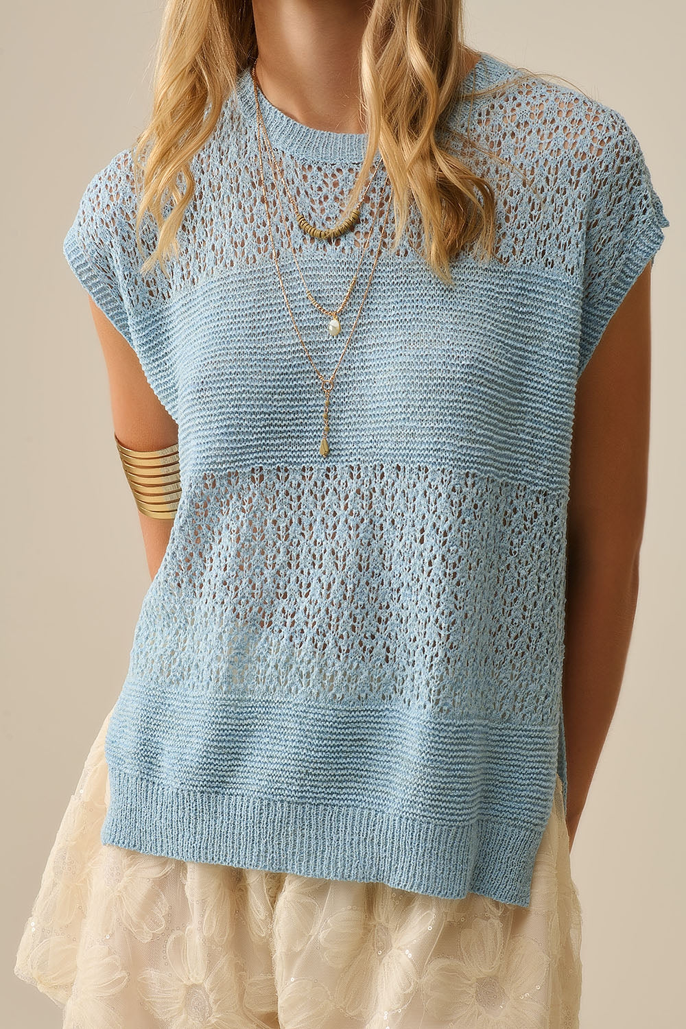 Blue sweater with soft open knit and dropped sleeves