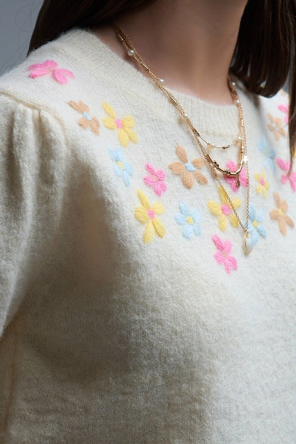 Cream chunky knit short-sleeved sweater with pastel-colored embroidered flowers