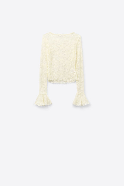 Cream lace top with long flared sleeves and ruffles