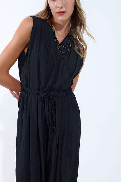 draped black jumpsuit in crinkled fabric