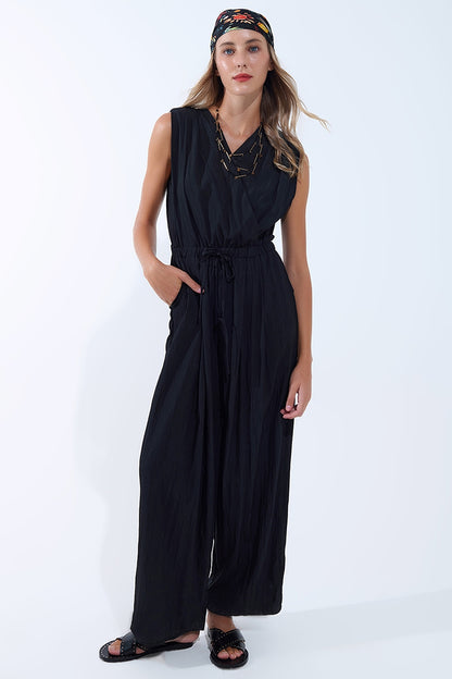 Q2 draped black jumpsuit in crinkled fabric