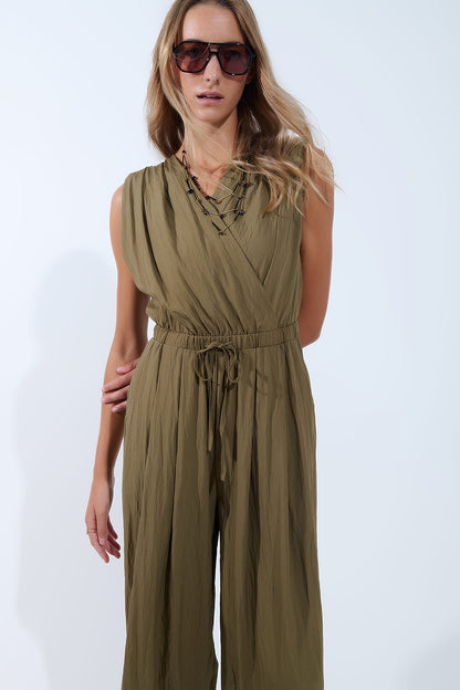 draped olive jumpsuit in crinkled fabric