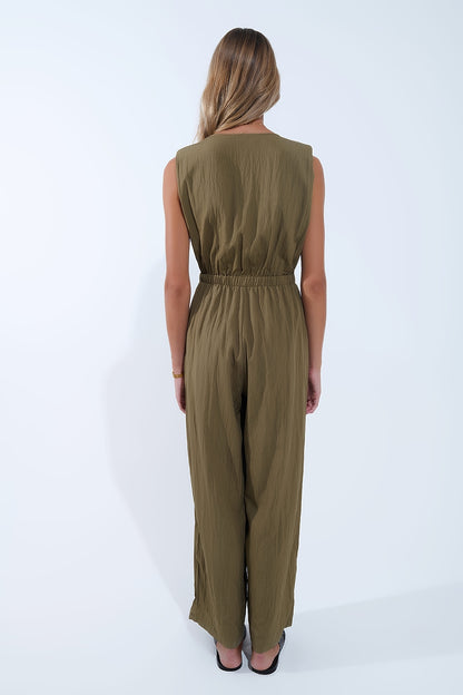 draped olive jumpsuit in crinkled fabric