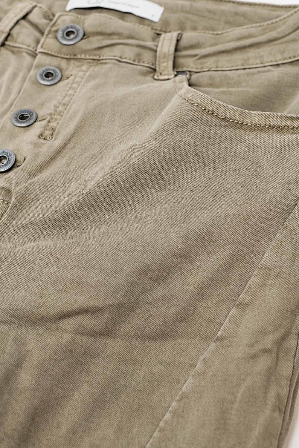Exposed buttons skinny jeans in dark beige