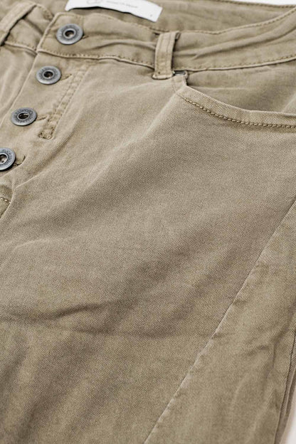 Exposed buttons skinny jeans in dark beige