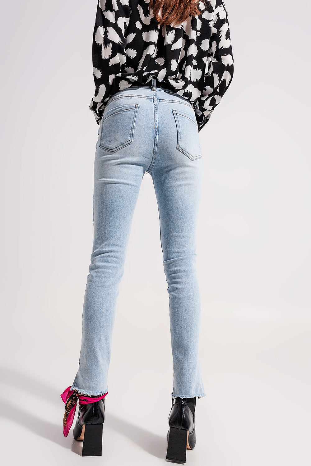 High waist jeans with slit hem in vintage wash