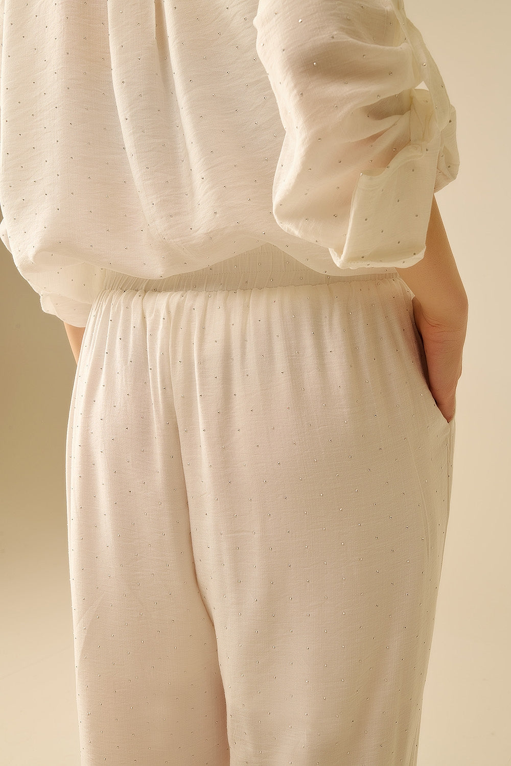 Lightweight wide-legged white pants with strass details