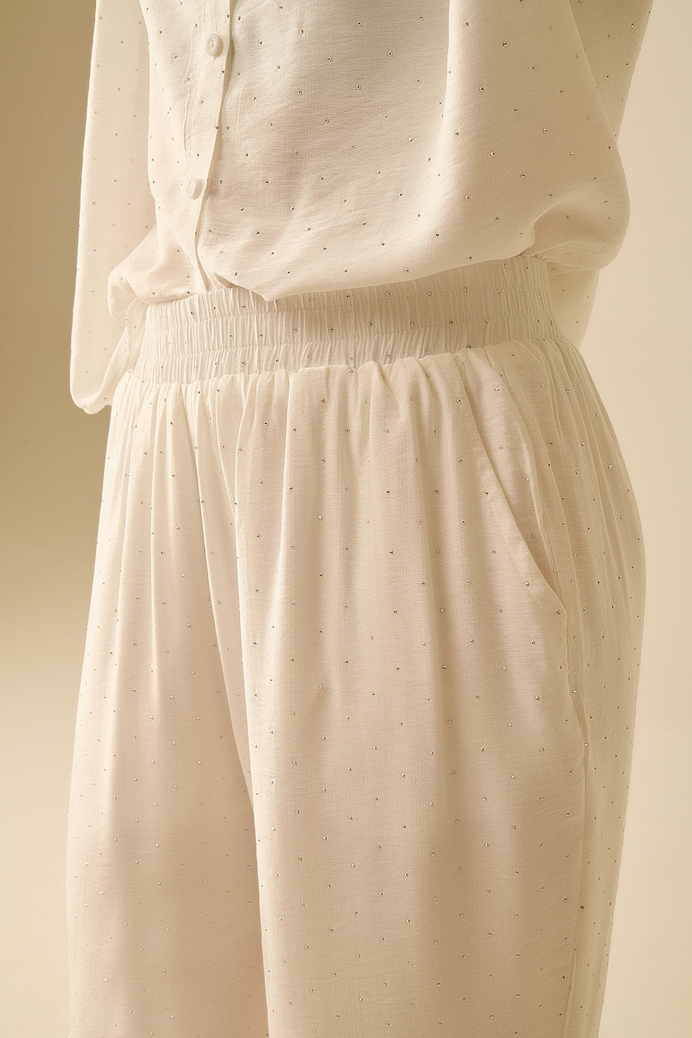 Lightweight wide-legged white pants with strass details