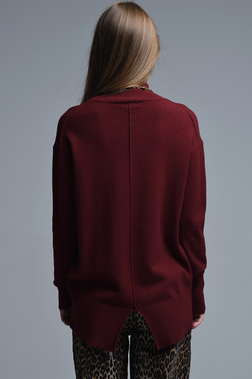 Loose burgundy sweater with open back detail