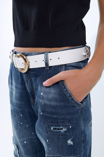 Loose-fitting jeans with distressed patches and paint details