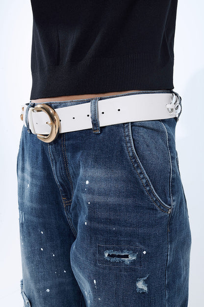 Loose-fitting jeans with distressed patches and paint details