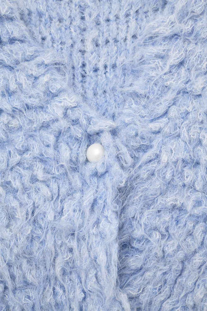 Luxurious vest with light blue long-haired texture