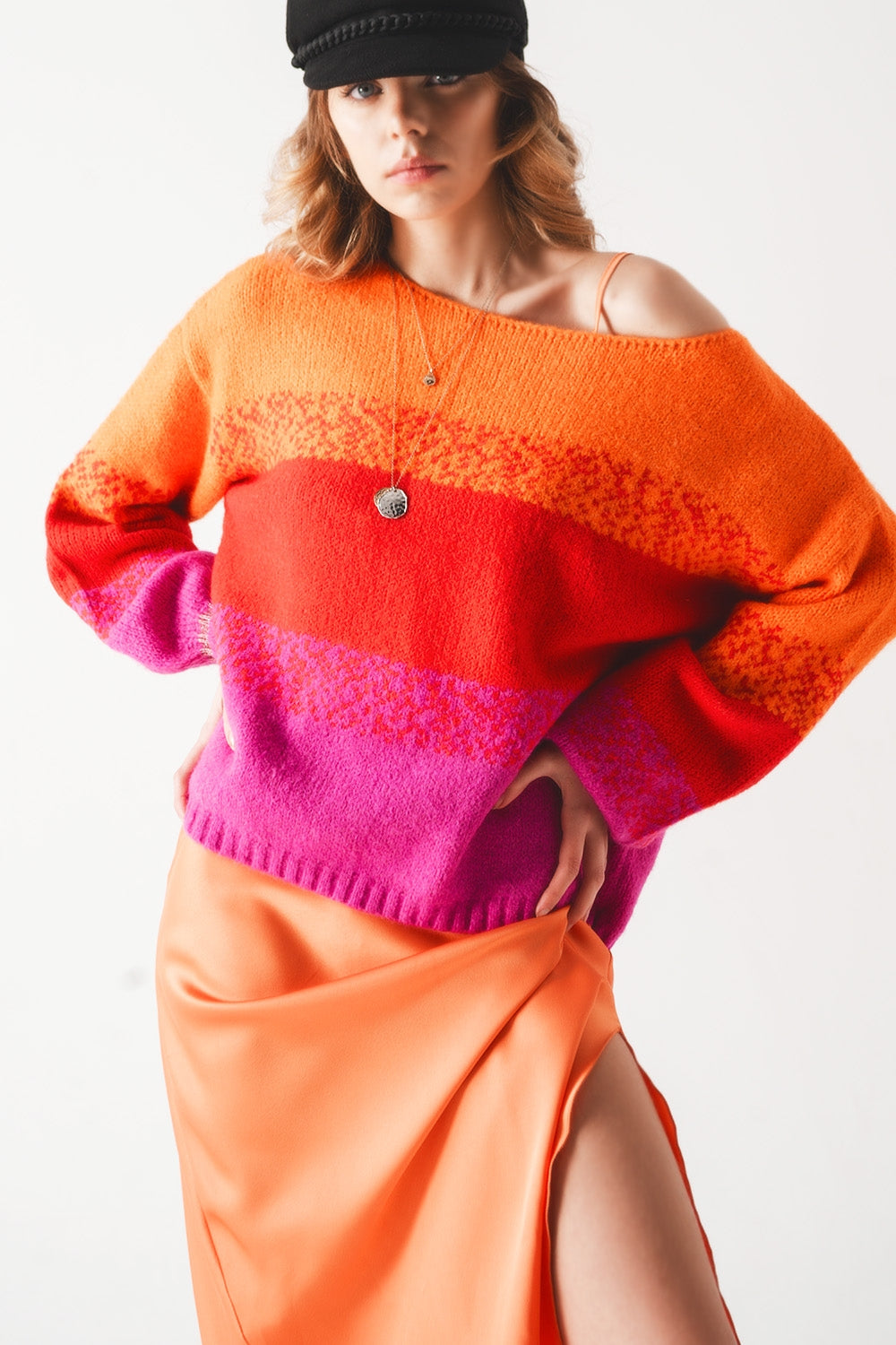 Orange knitted sweater with mélange stripes