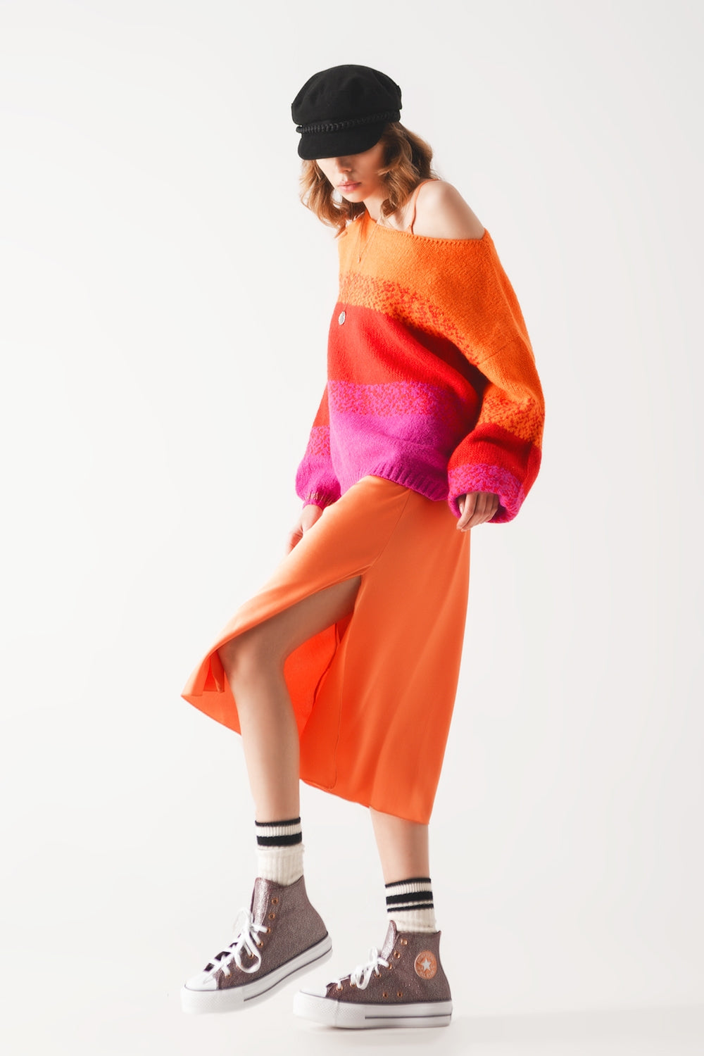 Orange knitted sweater with mélange stripes