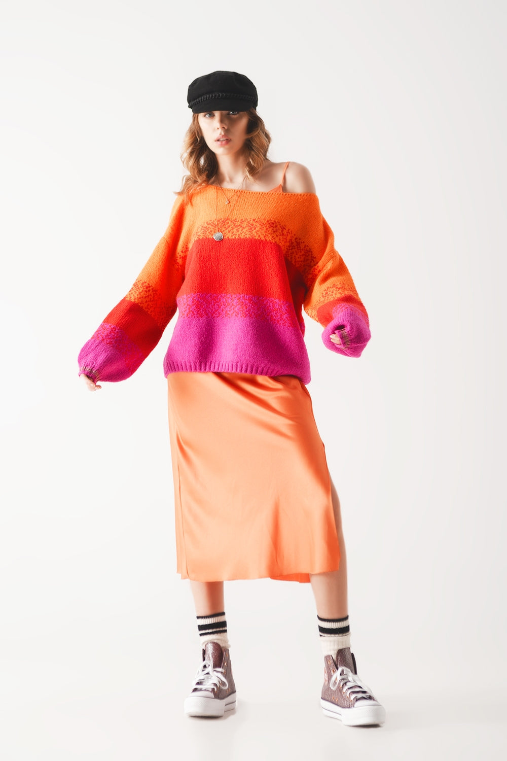 Orange knitted sweater with mélange stripes