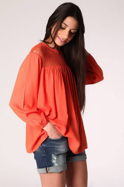 Orange smock blouse with cage detail