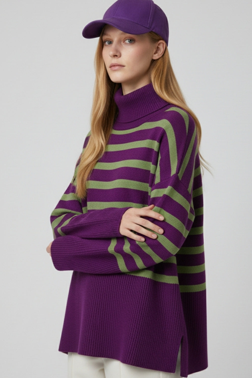Purple oversized turtleneck sweater with green stripes and splits on the side