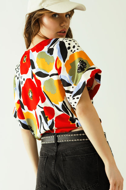 Relaxed white blouse with poppies designs and short sleeves