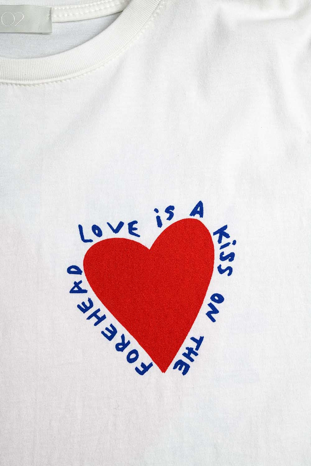 Relaxed white T-shirt featuring a heart design on both the front and back